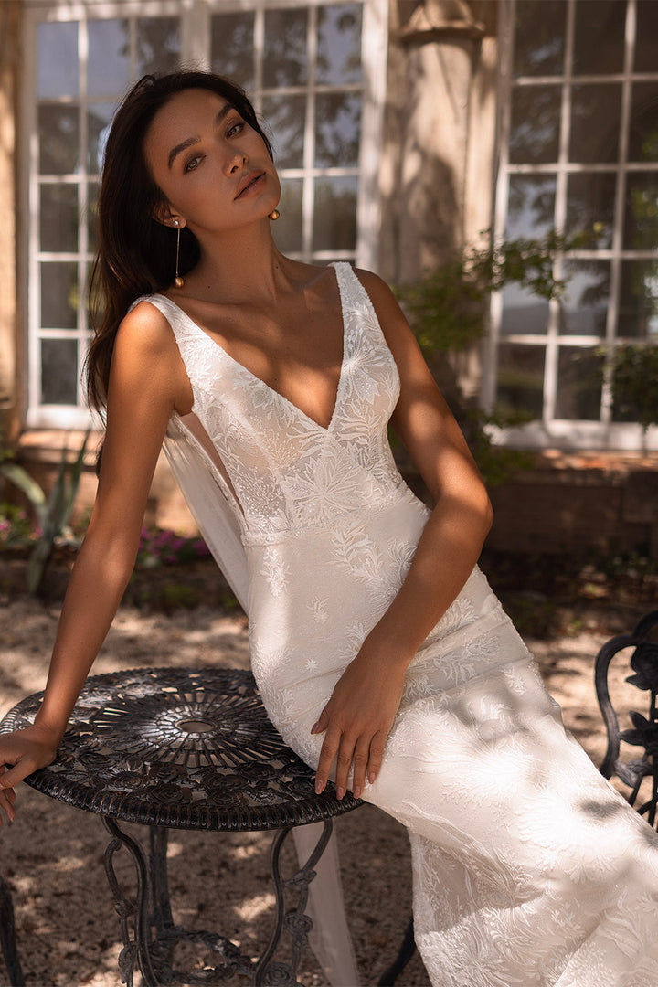 Bruna by Elly Bride | All-over Lace Mermaid Wedding Dress, V-neck, Sheer side panels, Front View Close Up Sitting | The Laid Back Bride