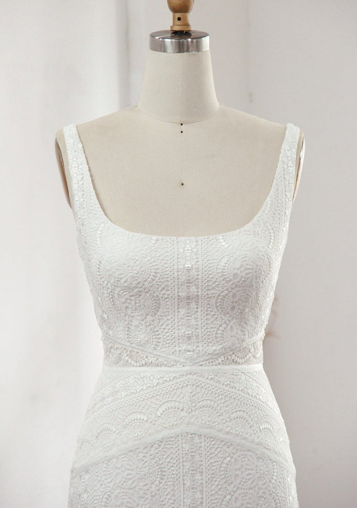 Modern lace wedding dress close up of the front on a mannequin.