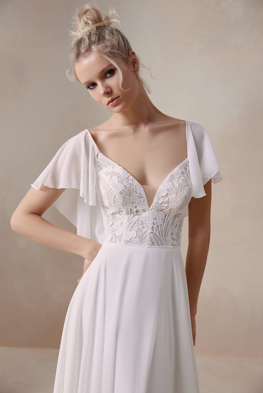 Elma by Elly Bride | Minimalist A-line Wedding Dress, Flutter Sleeves, V-neck Modern Lace Bodice, Up Close Front View | The Laid Back Bride