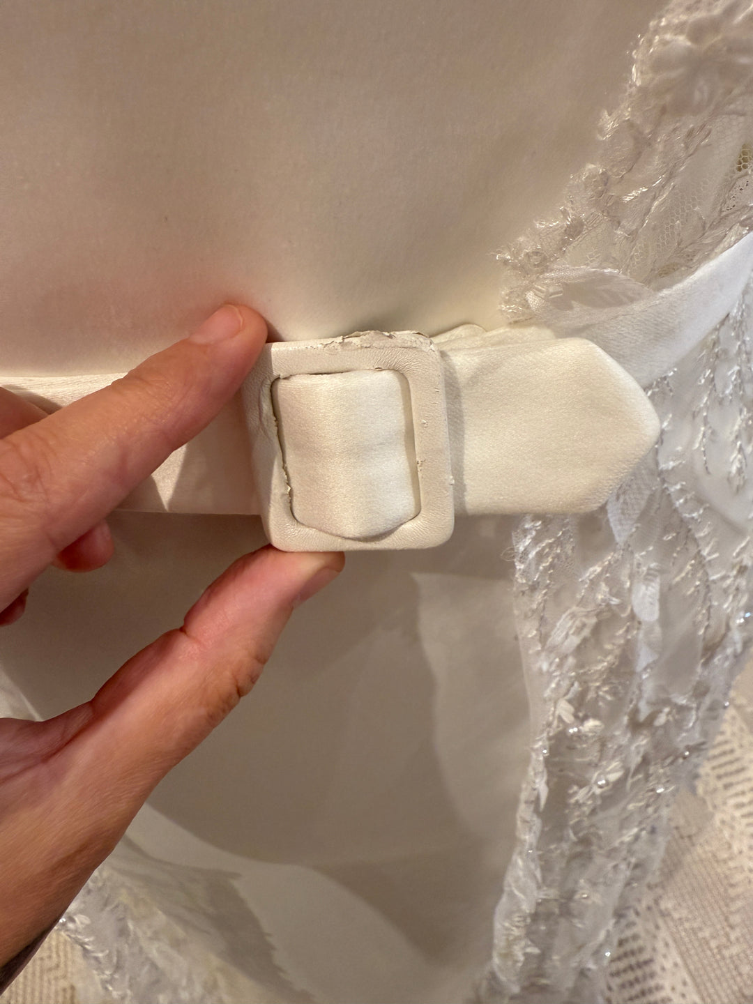 Close up of the Erica by Katy Corso sample gown robe belt.