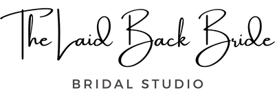 A logo-style graphic on a white background with the words 'The Laid Back Bride' in large black cursive script and 'BRIDAL STUDIO' below in smaller gray sans-serif text.