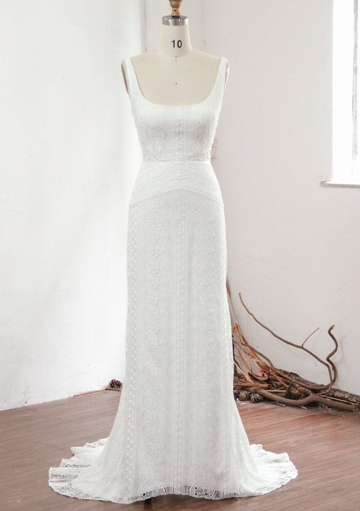 Modern lace column wedding dress on a mannequin.